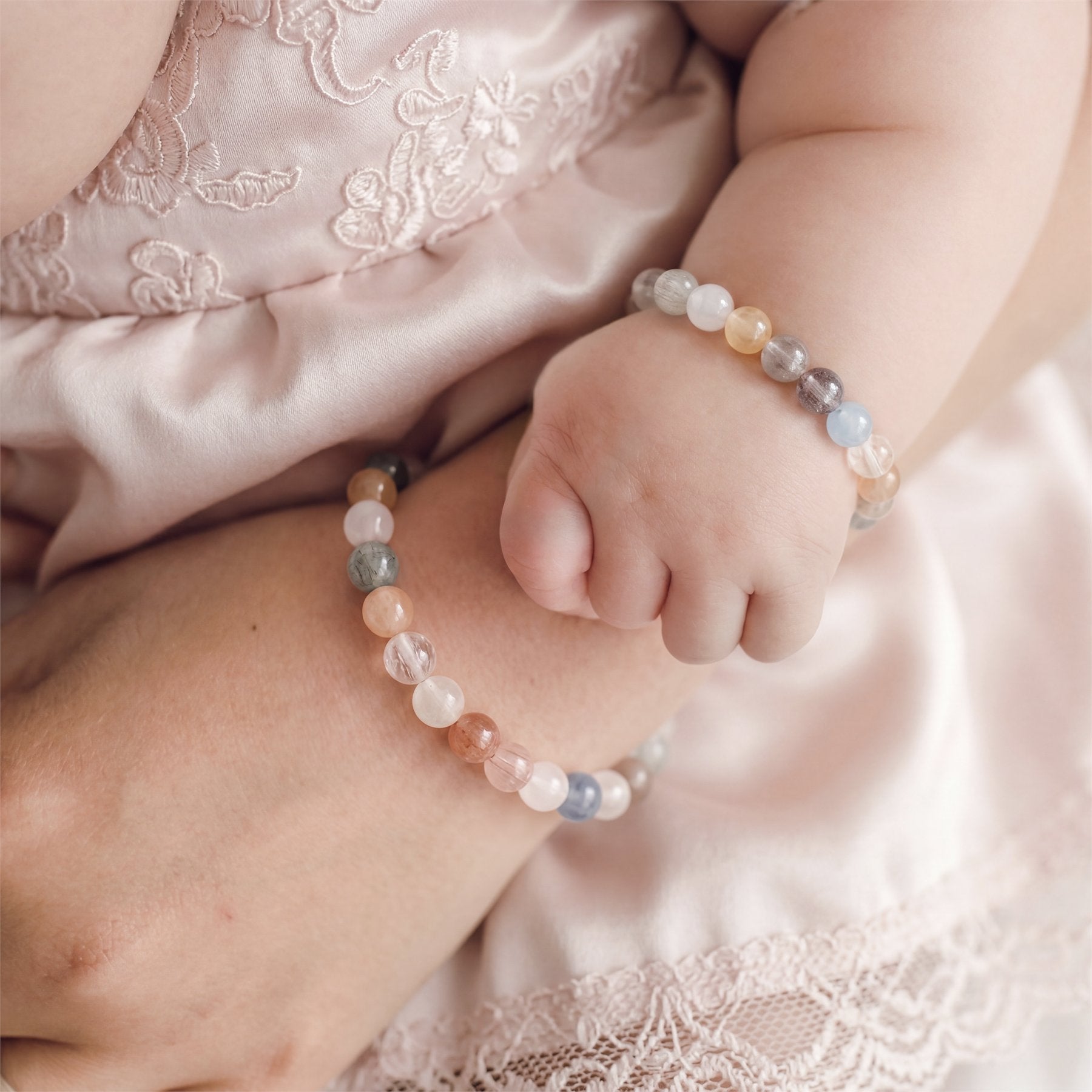 A mother and child wearing Ripples jewelry
